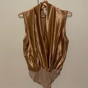 |Sleeveless mocha body suit, never been worn|